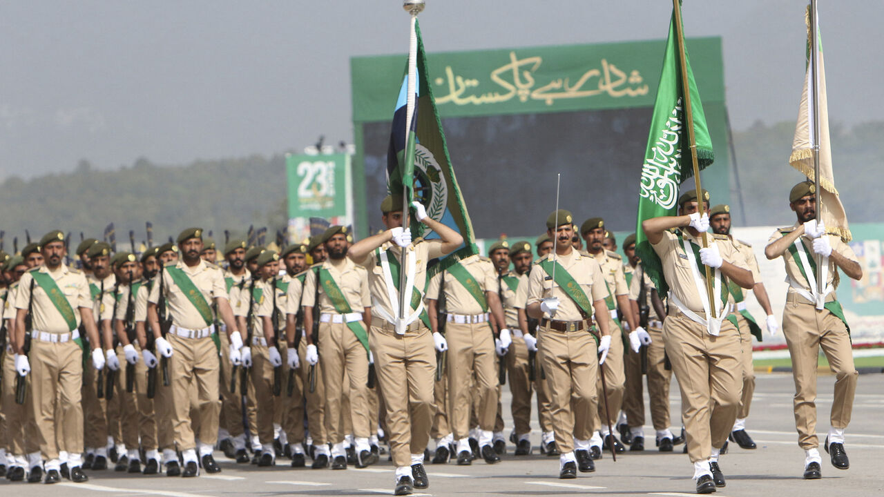 Saudi Arabia's army soldiers march during the Pakistan Day parade in Islamabad on March 23, 2022. 