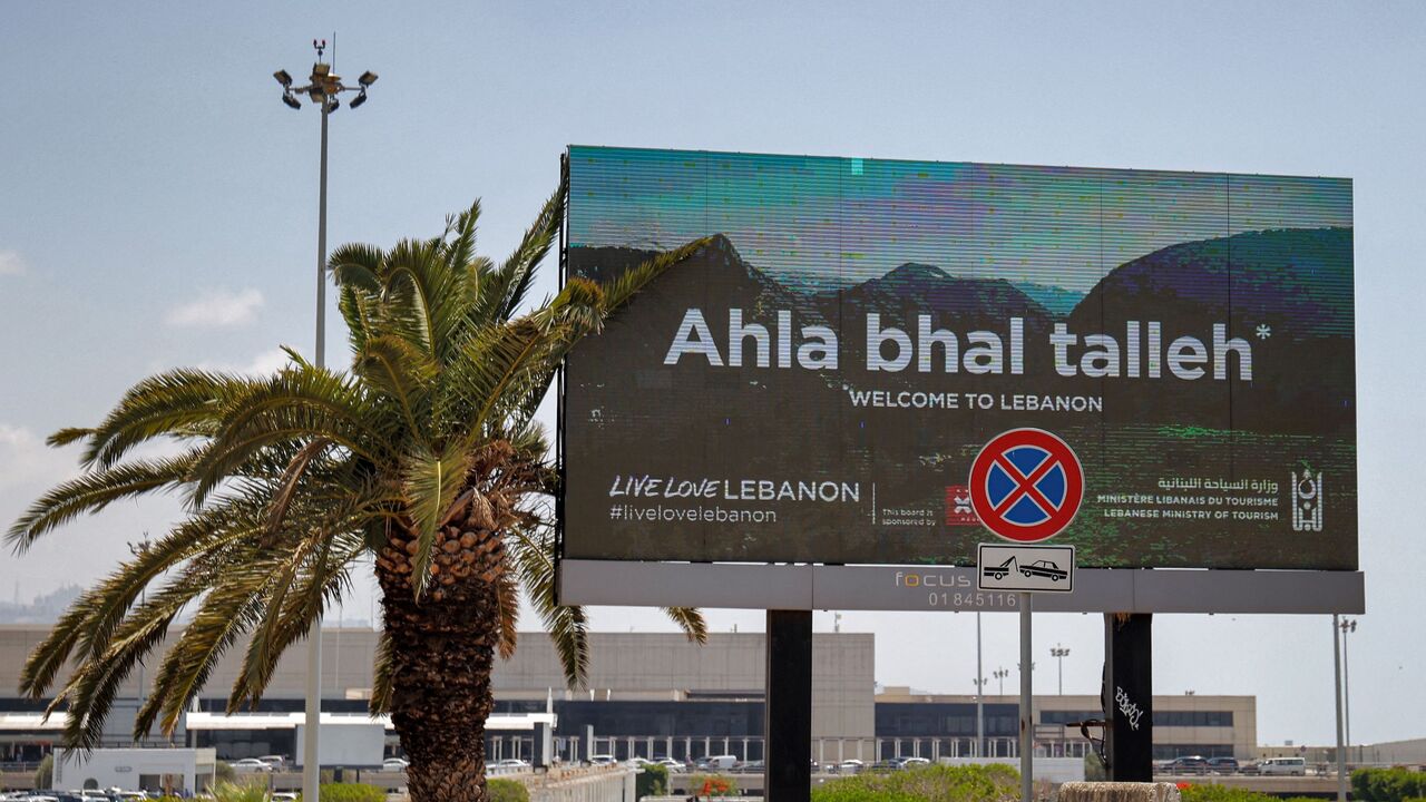 A welcoming billboard is seen along the airport road in Beirut on June 22, 2022.