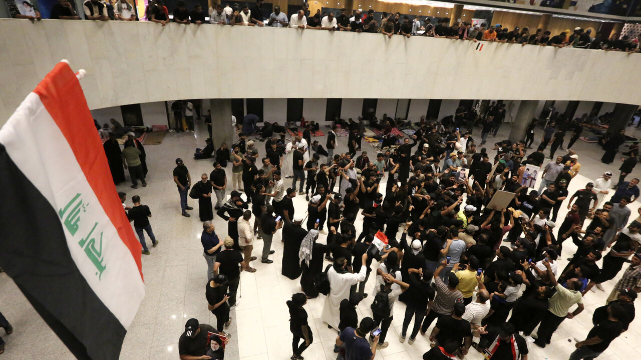 Supporters of Iraqi cleric Muqtada al-Sadr, protesting against a rival bloc's nomination for prime minister, gather inside the parliament building a day after storming it, Green Zone, Baghdad, Iraq, July 31, 2022.