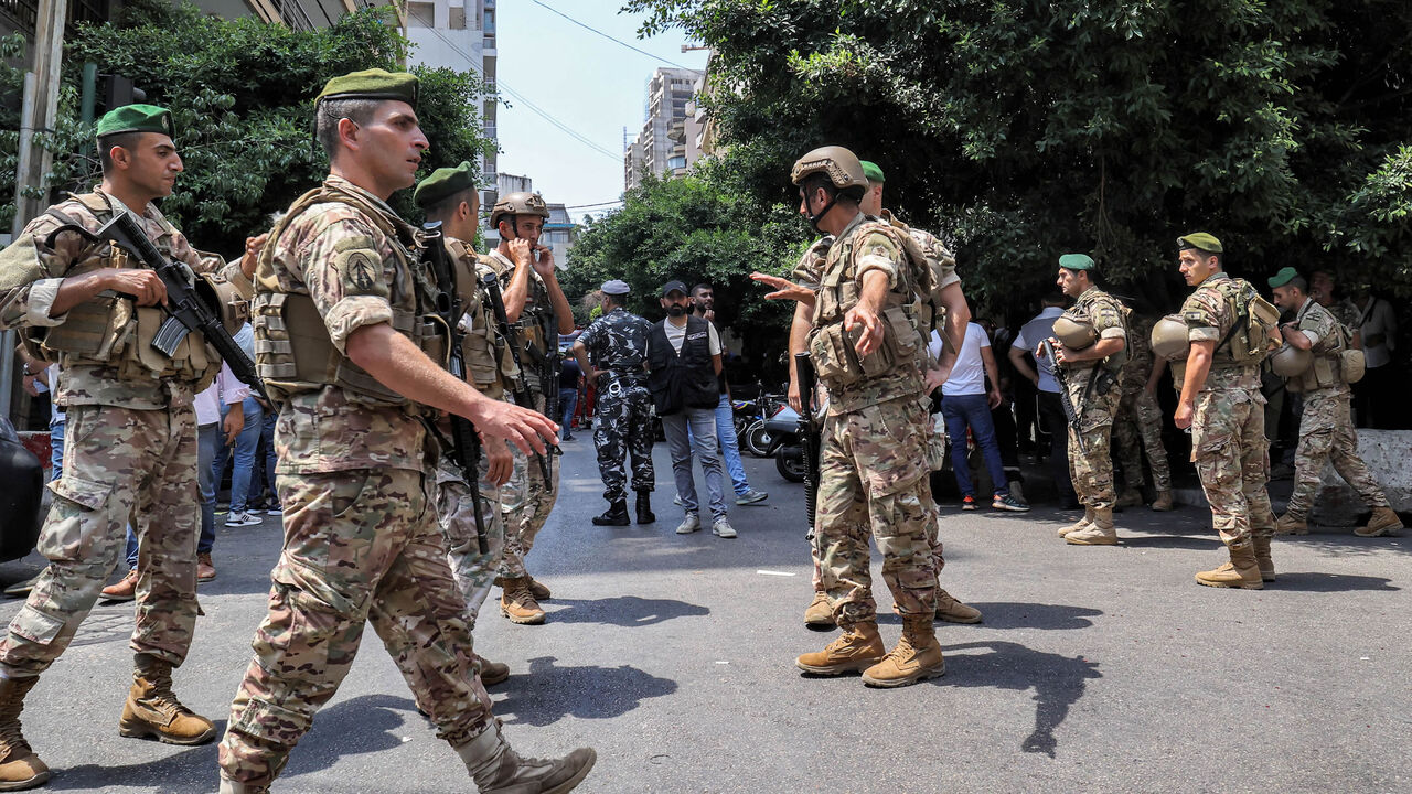 Army soldiers gather near a Federal Bank branch, Beirut, Lebanon, Aug. 11, 2022.