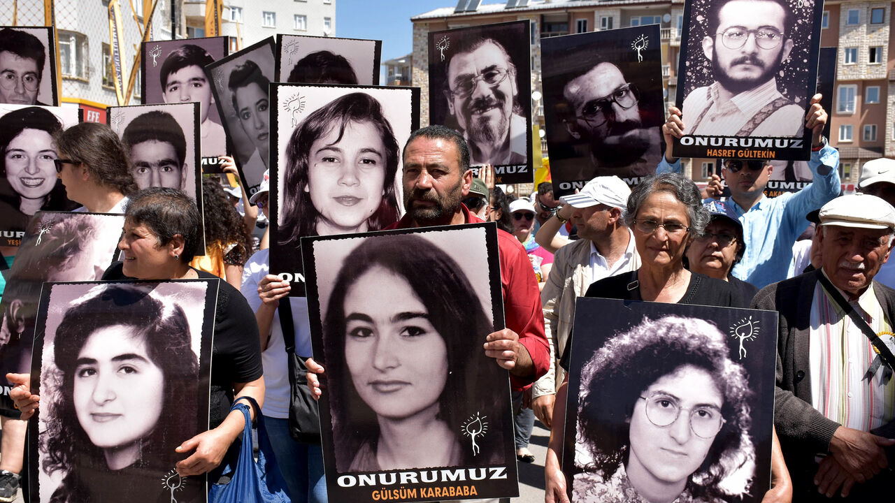 Turkish activists and opposition members gather with pictures of victims — largely from the Alevi community — killed in Madimak Otel on July 2, 2018, in Sivas.