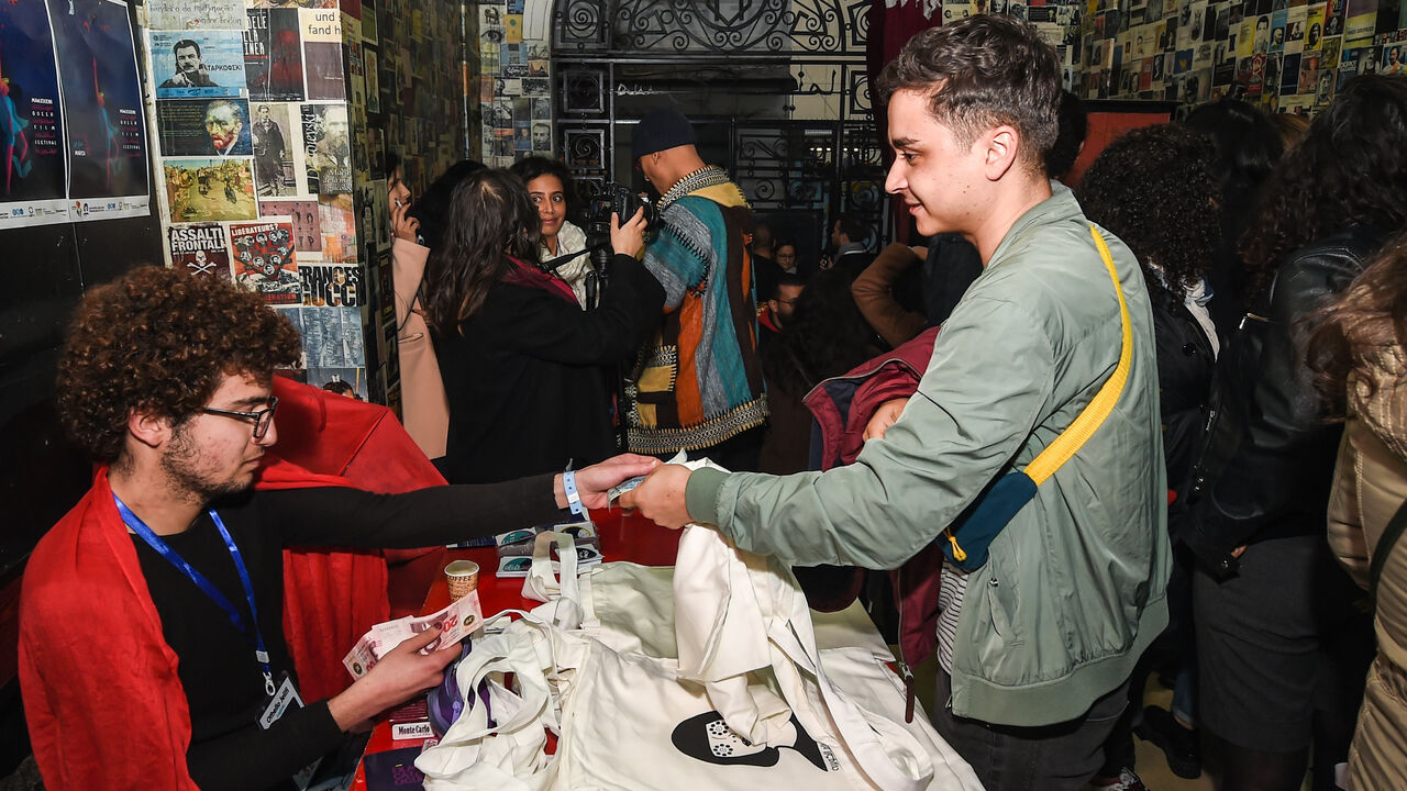 Tunisians arrive to attend the opening of the second edition of the Mawjoudin Queer Film Festival, Tunis, Tunisia, March 22, 2019.