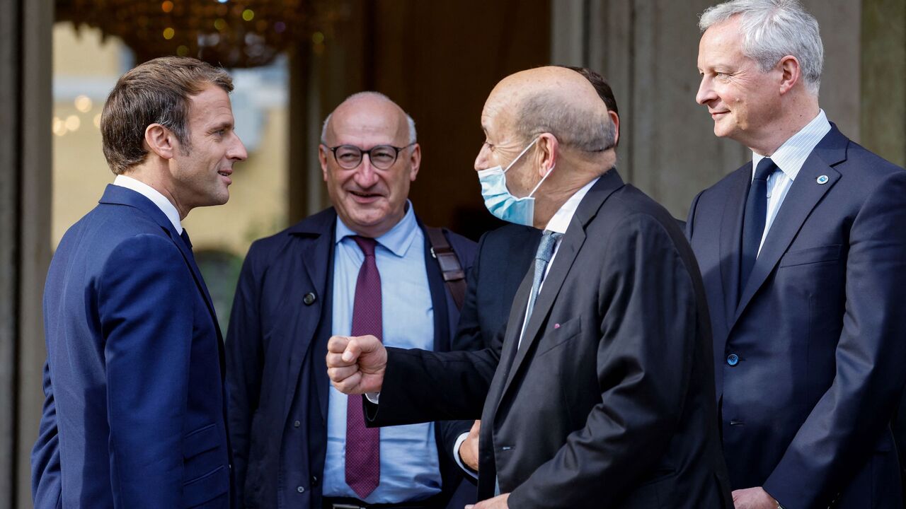 (from L) French President Emmanuel Macron (L), France's ambassador to the USA Philippe Etienne, French Foreign Minister Jean-Yves Le Drian and French Economy Minister Bruno Le Maire arrive at the French Embassy to the Vatican in Rome on October 29, 2021 ahead of a meeting with US President. (Photo by Ludovic MARIN / AFP) (Photo by LUDOVIC MARIN/AFP via Getty Images)