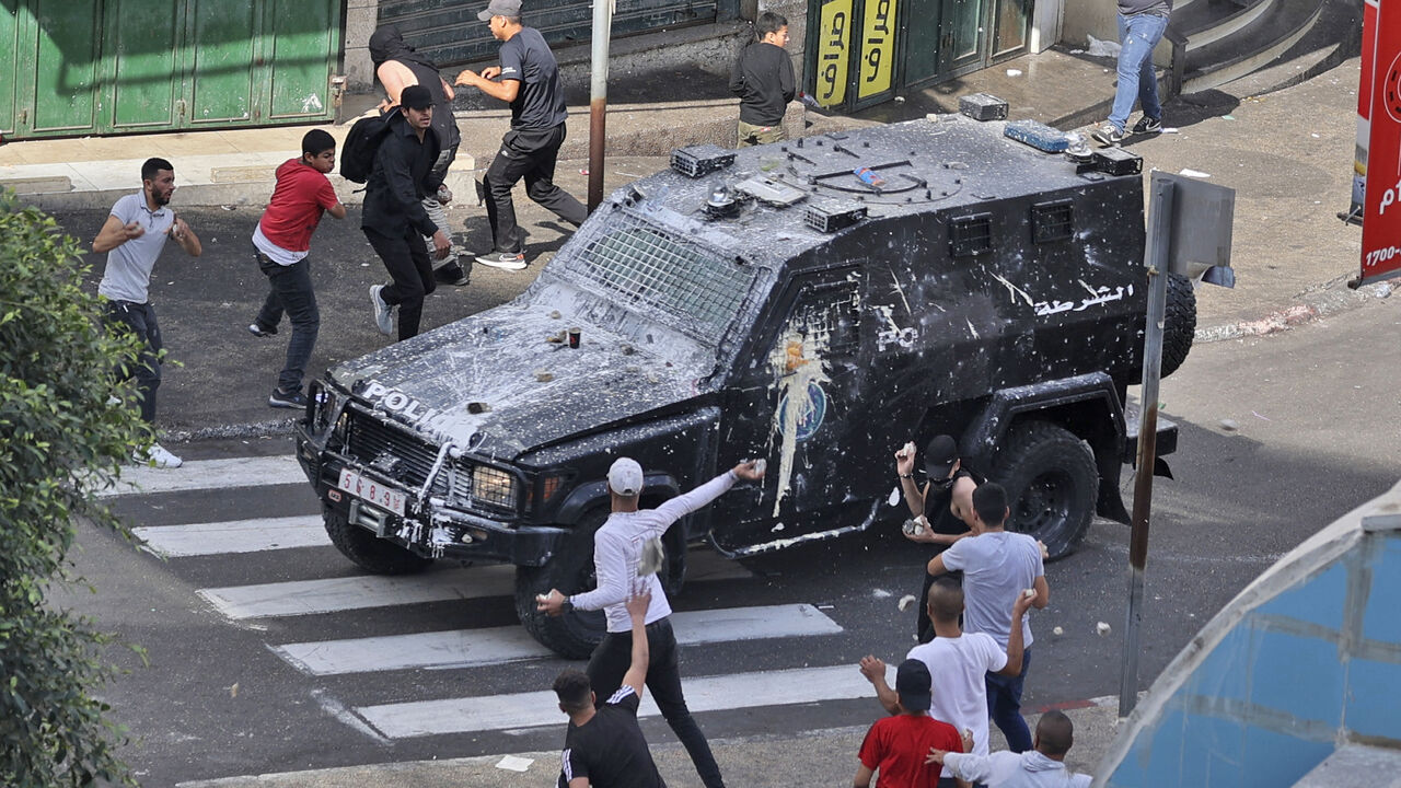 Palestinian protesters clash with Palestinian security forces following the arrest of two members of Hamas, Nablus, West Bank, Sept. 20, 2022.