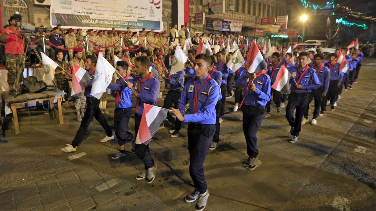 Yemeni scouts participate in an official parade marking the eighth anniversary of the Houthi takeover of Sanaa, Yemen, Sept. 20, 2022.