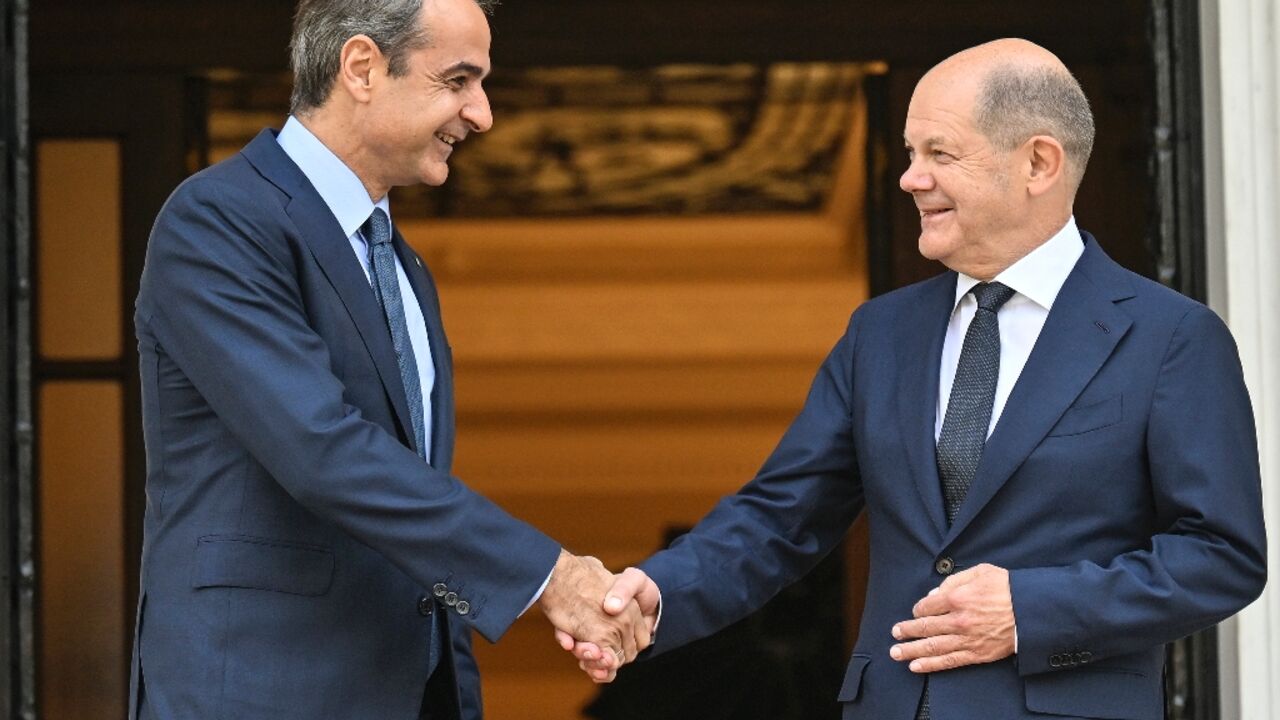 Greek PM Mitsotakis (L) met German Chancellor Scholz (R) on Thursday Greek PM Mitsotakis (L) met German Chancellor Scholz (R) on Thursday