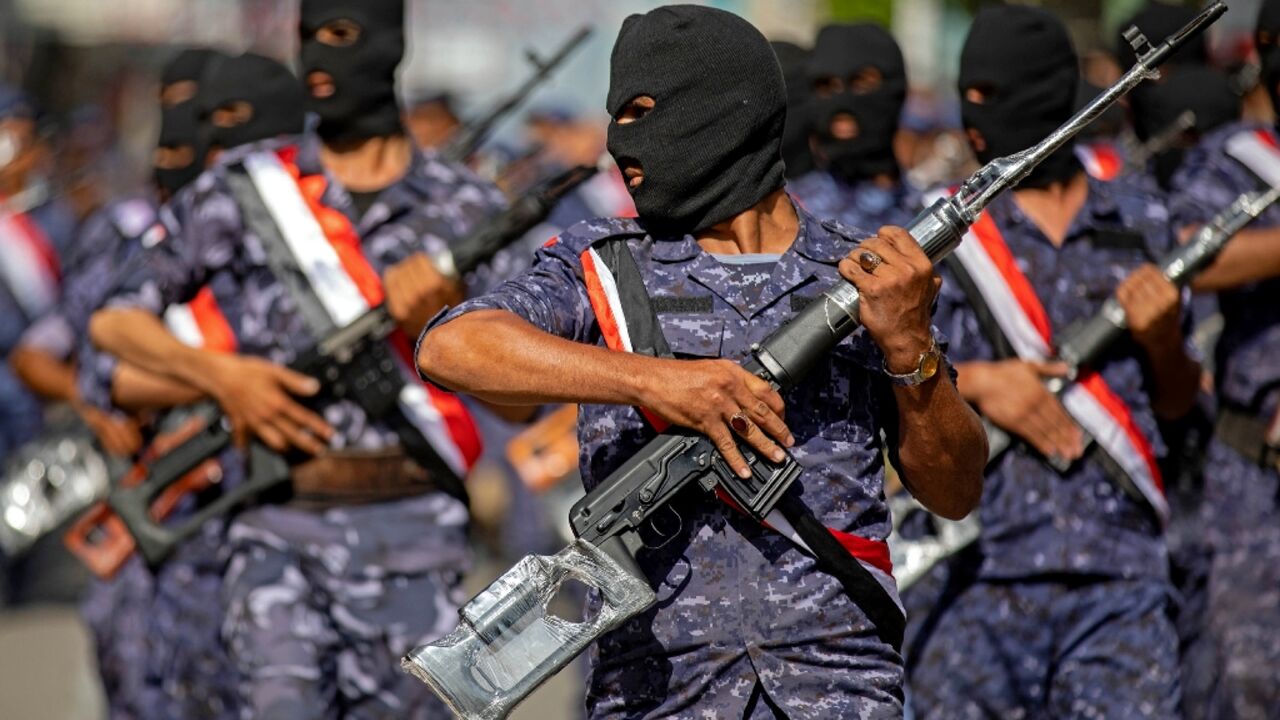 Yemeni government security forces take part in a military parade in the third city of Taez on September 26 Yemeni government security forces take part in a military parade in the third city of Taez on September 26