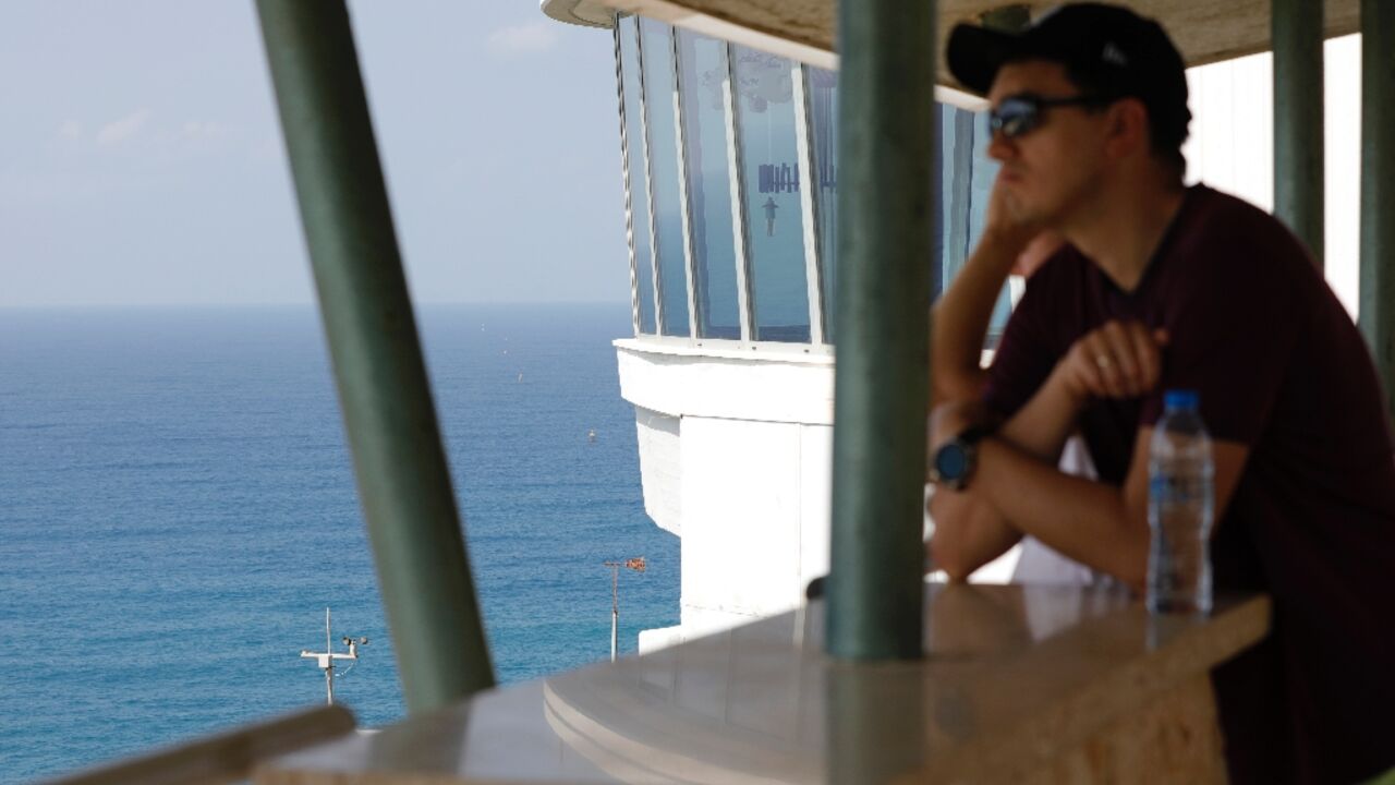 A man looks out to sea towards maritime border markers in Mediterranean waters off Israel's crossing at Rosh Hanikra, known in Lebanon as Ras al-Naqura A man looks out to sea towards maritime border markers in Mediterranean waters off Israel's crossing at Rosh Hanikra, known in Lebanon as Ras al-Naqura