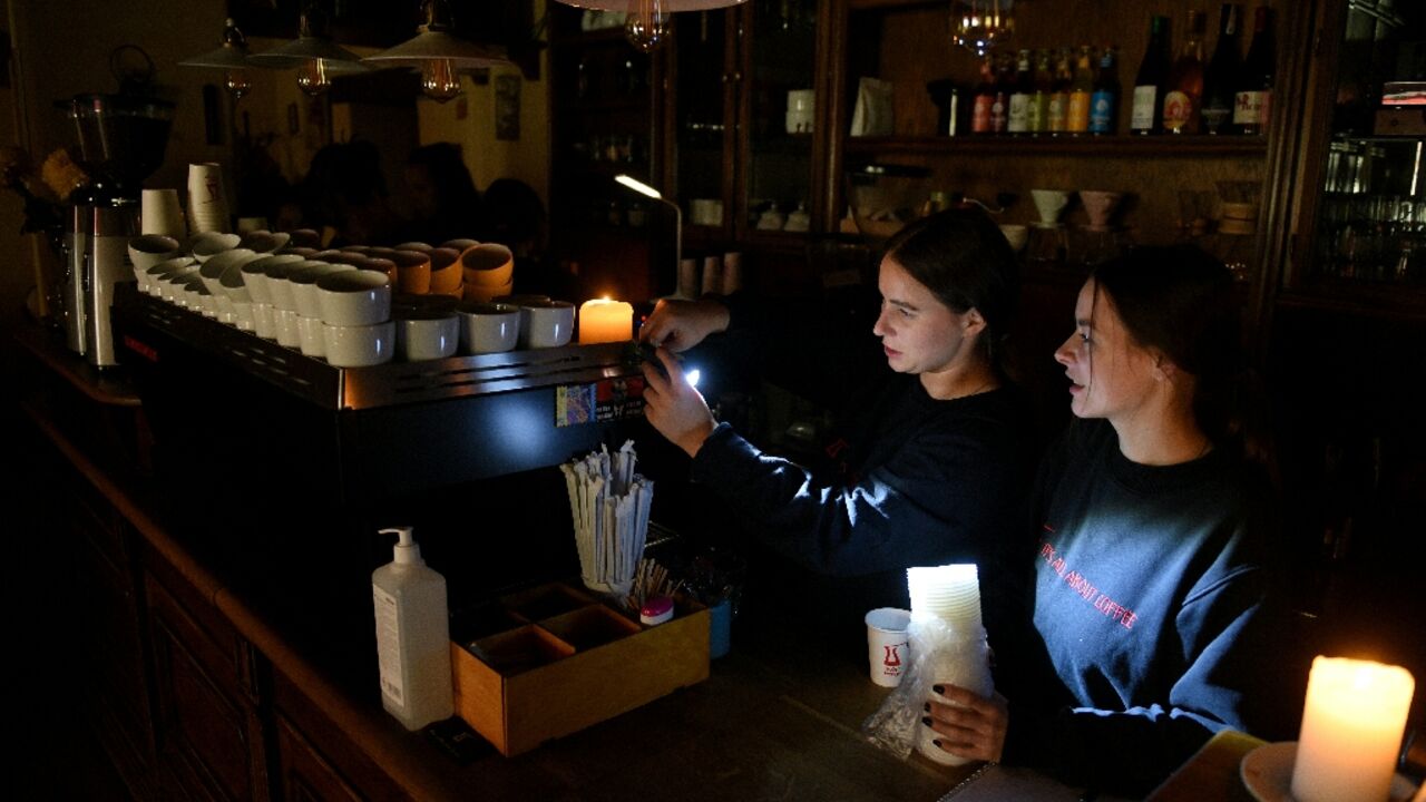 Employees prepare coffee in a cafe without electricity in western Ukrainian city of Lviv, after Russian missiles targeted energy infrastructure Employees prepare coffee in a cafe without electricity in western Ukrainian city of Lviv, after Russian missiles targeted energy infrastructure