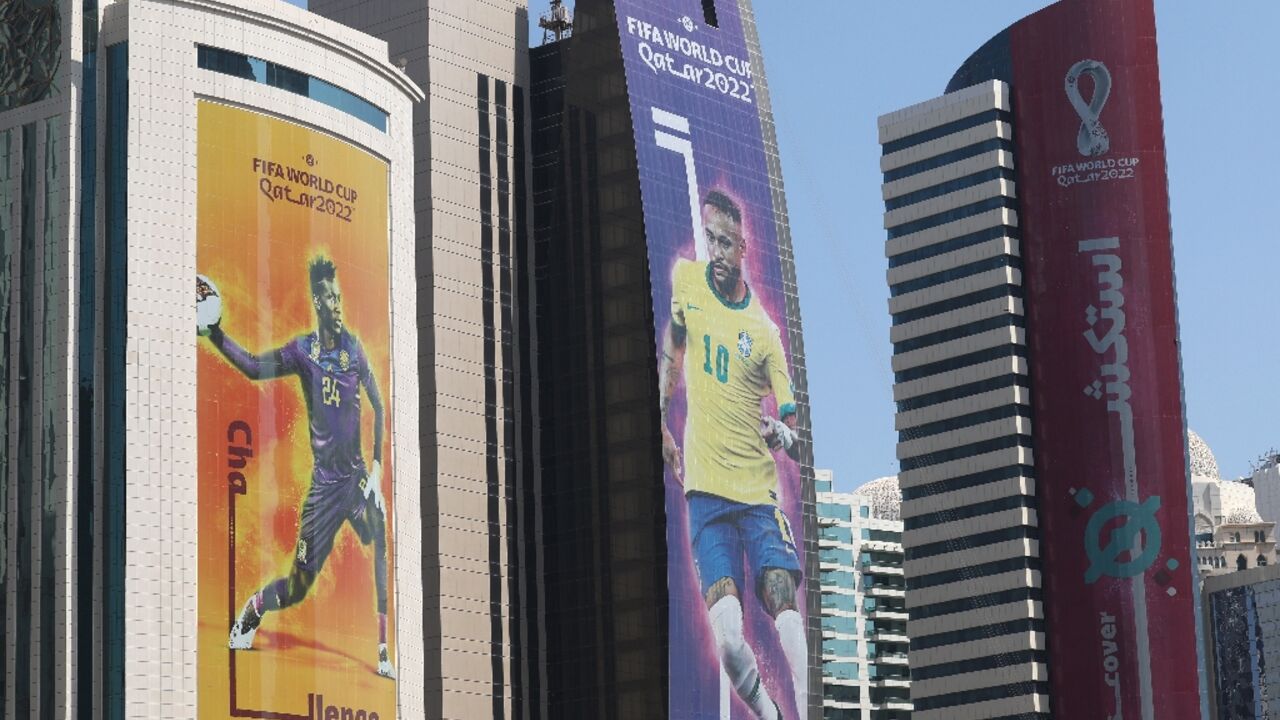 Banners on buildings in the Qatari capital Doha show Neymar and other World Cup stars