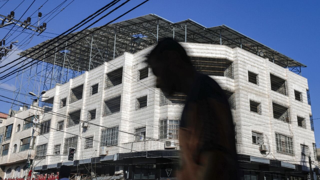 For most of Gaza's 2.3 million residents, power cuts are a daily occurrence, and many are turning to solar power, such as these panels on the roof of a bakery