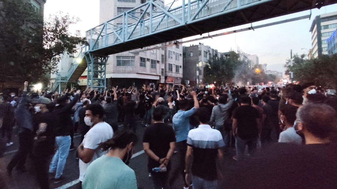 A picture obtained by AFP outside Iran on Sept. 21, 2022, shows Iranian demonstrators taking to the streets of the capital Tehran during a protest for Mahsa Amini, days after she died in police custody. 