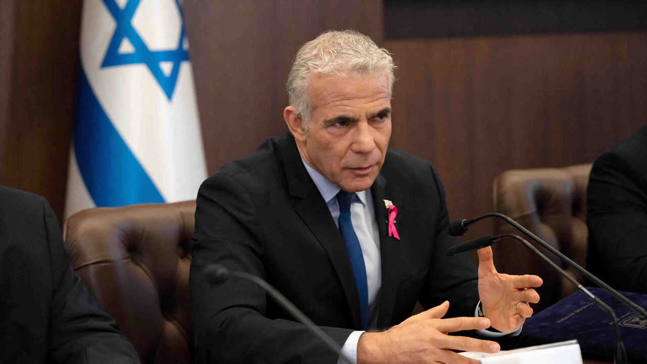 Israeli Prime Minister Yair Lapid makes an opening statement as he chairs the weekly Cabinet meeting, Jerusalem, Oct. 2, 2022.