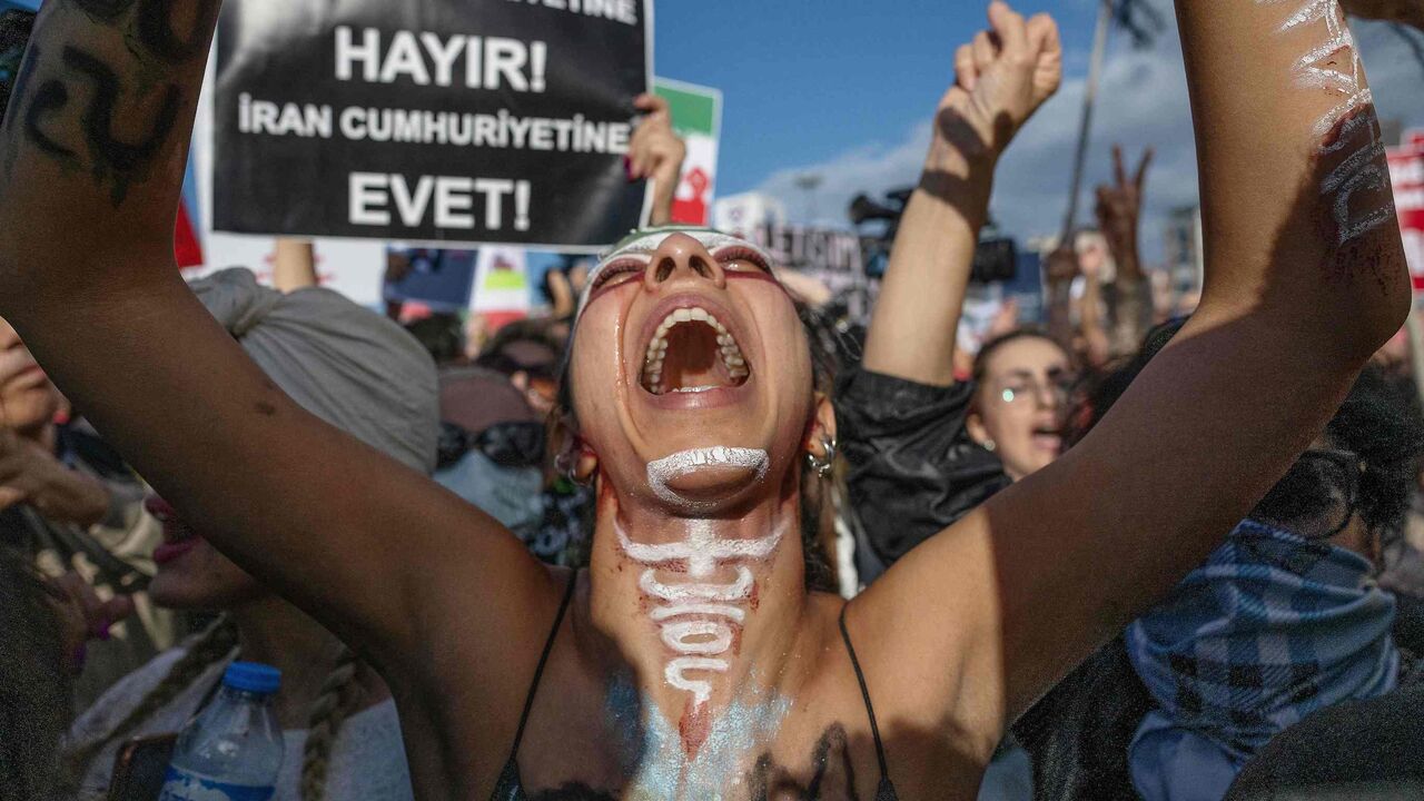 A protestor shouts slogans during a demonstration against the Iranian regime.