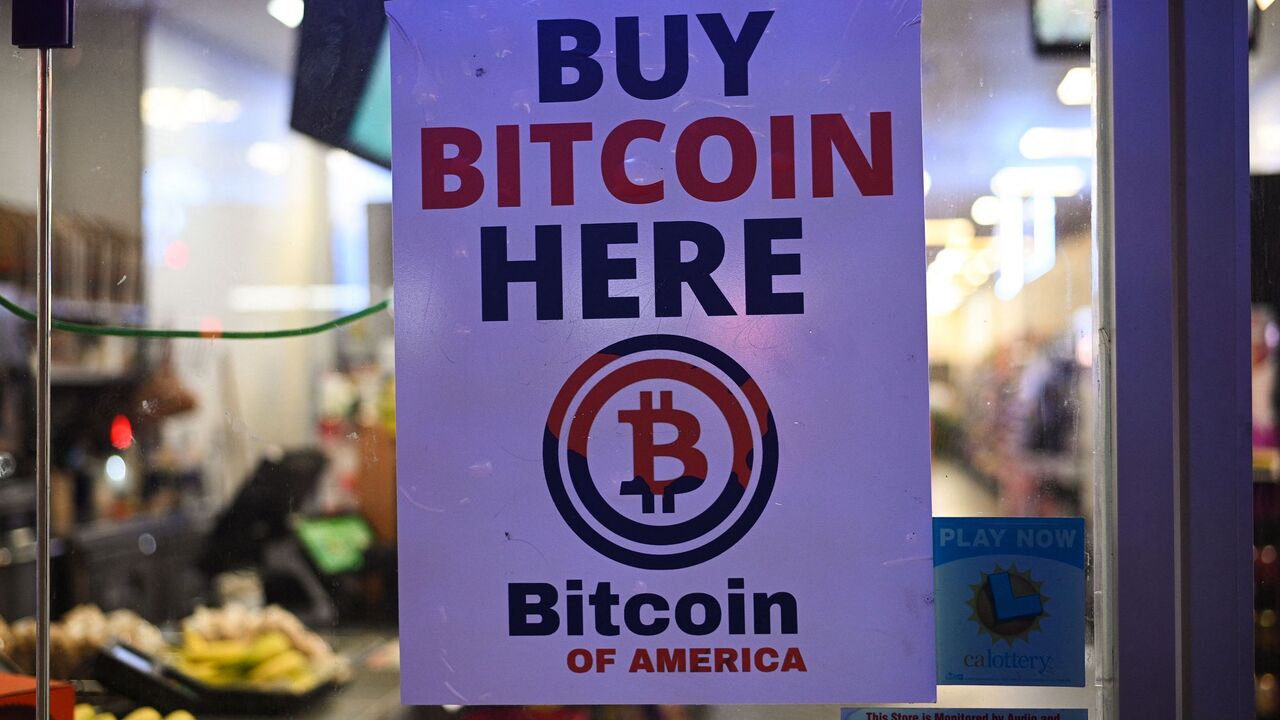 A sign offering Bitcoin for sale is seen in a store window in Hollywood, California, Oct. 20, 2022