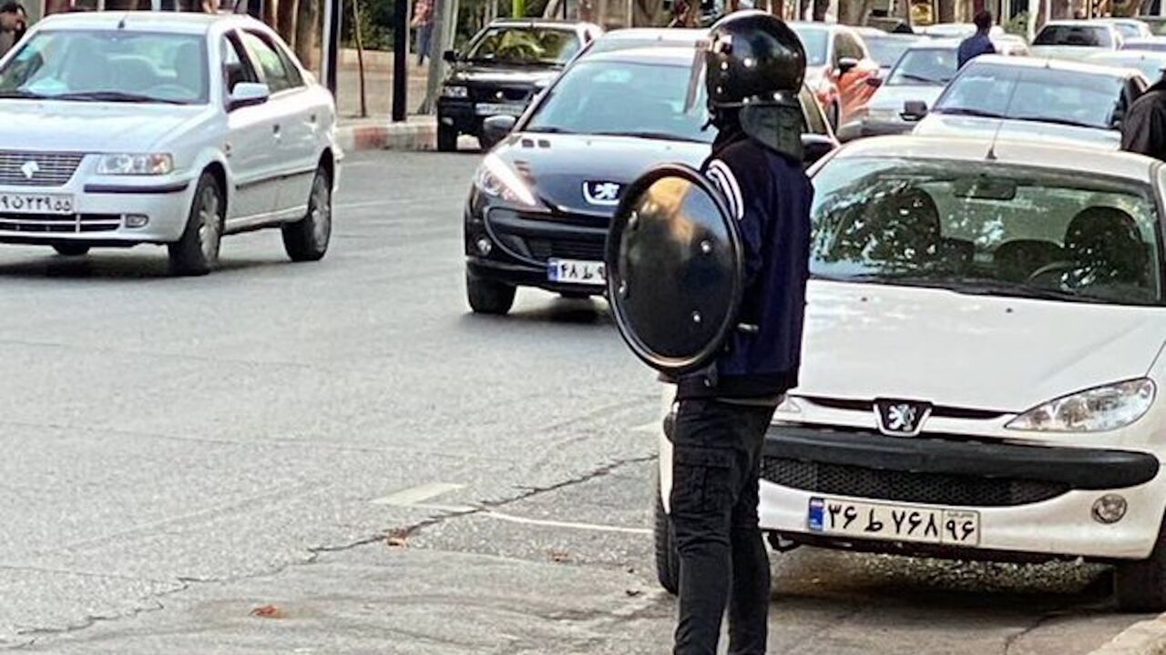There are reports from different cities of Iran that the government of the Islamic Republic uses children under the age of 18 as repression forces. This child in Shahrood is wearing a military uniform and holding a baton
