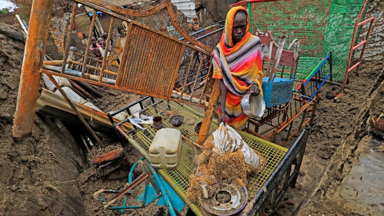 Blue Nile is awash with guns and is still struggling to rebuild after decades of civil war, with over 300 people killed in recent months: this photograph from August shows the aftermath of an attack