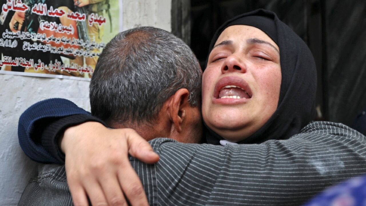 Relatives mourn the death of Palestinian teenager Mahdi Hashash during his funeral in the refugee camp of Balata near the West Bank city of Nablus