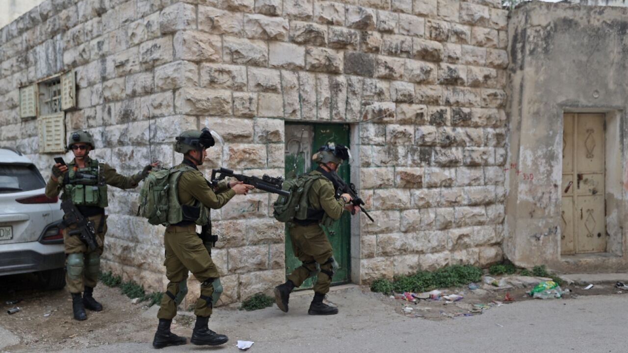 Israeli forces search the Palestinian village of Haris in the occupied West Bank on November 15 following an attack in which a Palestinian killed two Israelis Israeli forces search the Palestinian village of Haris in the occupied West Bank on November 15 following an attack in which a Palestinian killed two Israelis