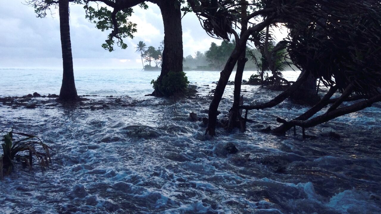 High tide boosted by storm surges wash across Majuro Atoll in the Marshall Islands in the Pacific, threatened by rising sea levels and increasingly intense tropical storms