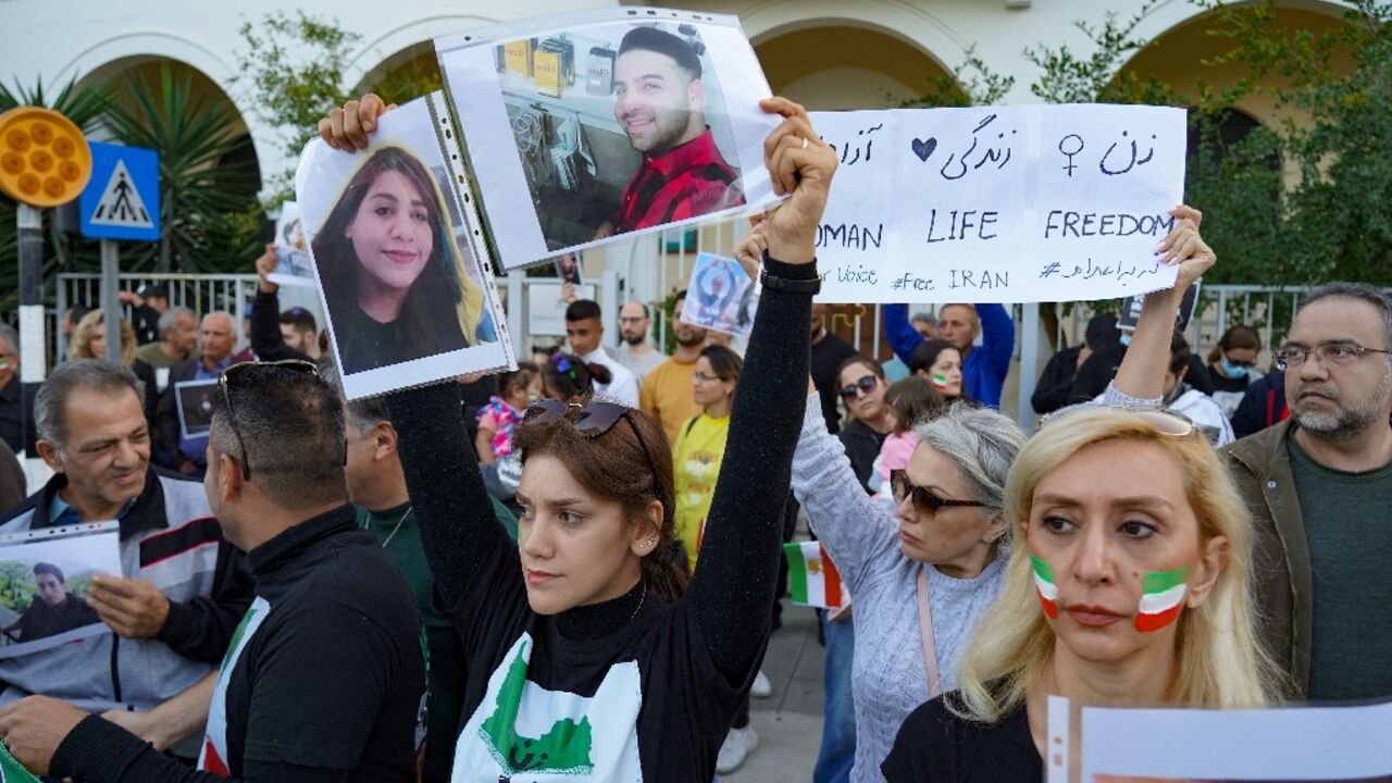 Iranian expatriates rally in front of their country's embassy in the Cypriot capital Nicosia on November 19, 2022, in solidarity with ongoing protests in the Islamic republic