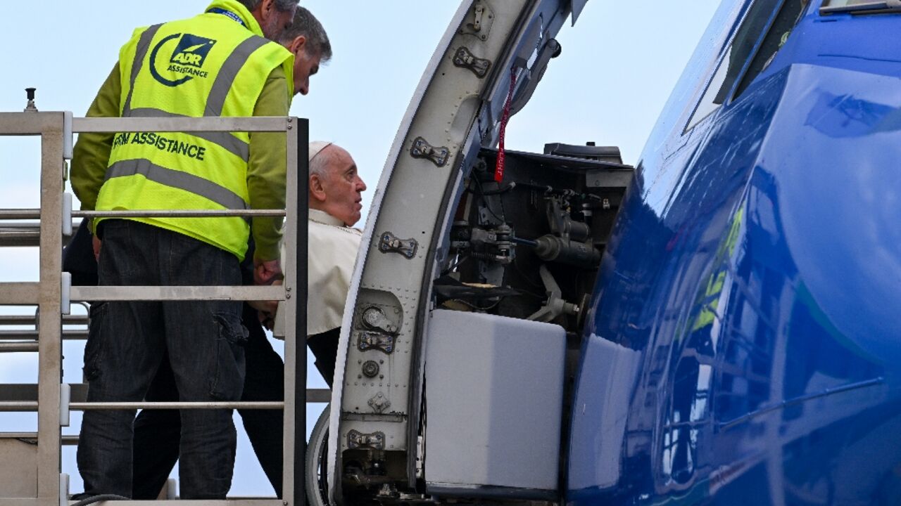 Pope Francis, seated on a wheelchair, boards a plane at Fiumicino airport to leave on a four-day trip to Bahrain Pope Francis, seated on a wheelchair, boards a plane at Fiumicino airport to leave on a four-day trip to Bahrain
