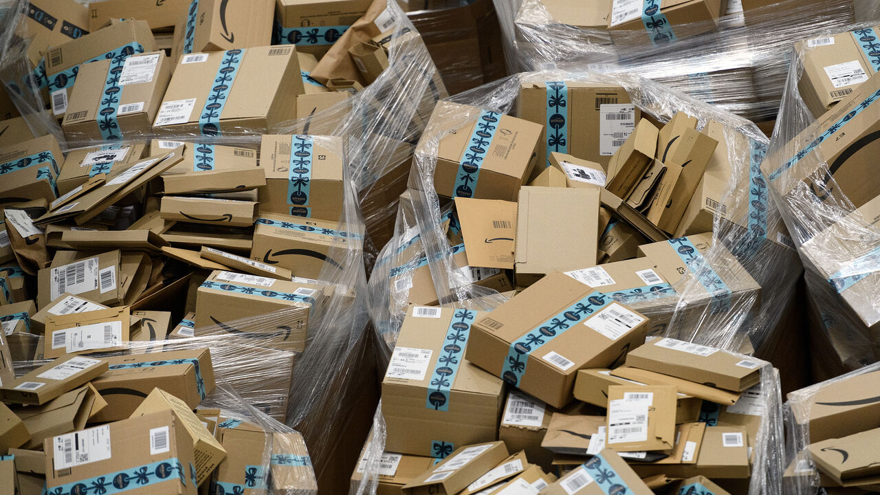 Completed customer orders are seen in their boxes, awaiting delivery, at the Amazon Fulfillment Center.