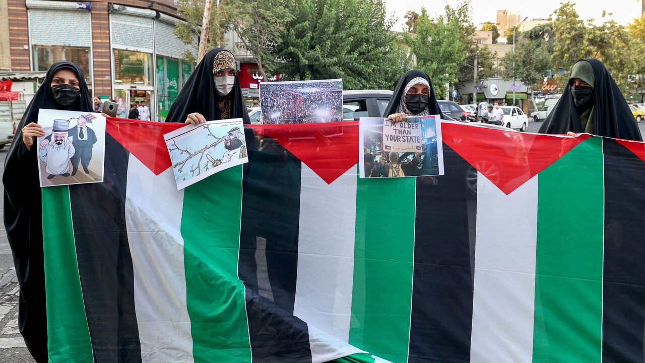 Iranian students from the Islamic Basij volunteer militia protest in Tehran on July 16, 2022.