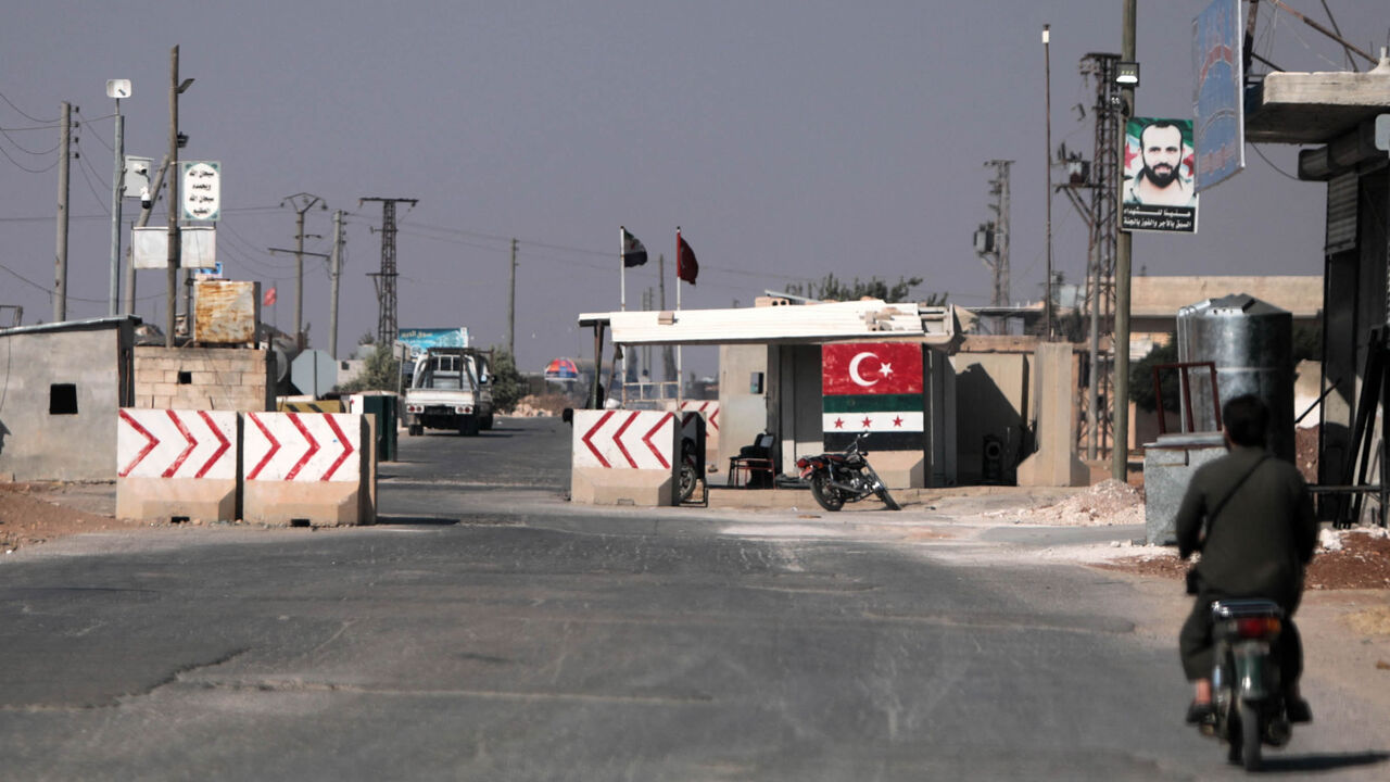 Turkey-backed Syrian fighters man a checkpoint in the town of Marea in the northern Aleppo governorate, facing the Kurdish-controlled area of Tal Rifaat, Syria, Aug. 2, 2022.