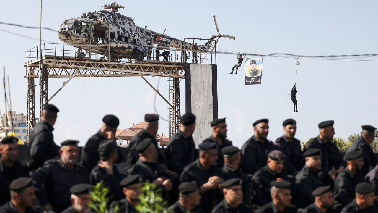 Members of the Hamas security forces show their skills in a drill held during a graduation ceremony, Gaza City, Gaza Strip, Oct. 31, 2022.