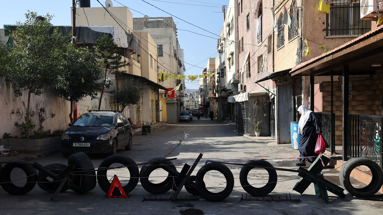 A barricade set up by Palestinians blocks a street in case of an Israeli army raid, Jenin, West Bank, Nov. 23, 2022.