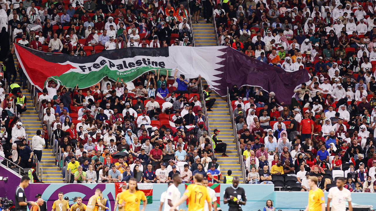 Fans hold up a banner reading "Free Palestine" during the FIFA World Cup Qatar 2022 Group A match between Netherlands and Qatar at Al Bayt Stadium on November 29, 2022 in Al Khor, Qatar.