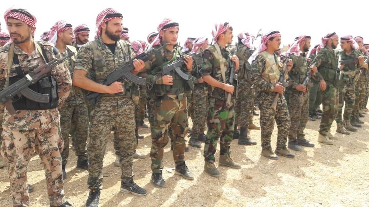 Members of the Baqir Brigade are seen in the city of Aleppo in this undated photo.