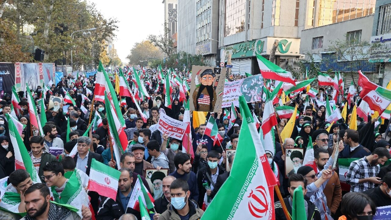 Iranians rally outside the former US embassy in Tehran to mark 43 years since supporters of the Islamic revolution took 50 embassy staff hostage