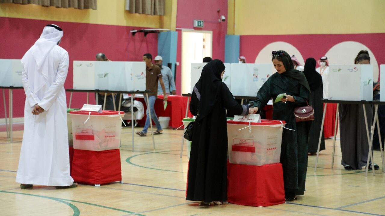 A Bahraini woman casts her ballot at a polling station in the city of Jidhafs, about 3km west of the capital Manama, during parliamentary elections on Saturday A Bahraini woman casts her ballot at a polling station in the city of Jidhafs, about 3km west of the capital Manama, during parliamentary elections on Saturday