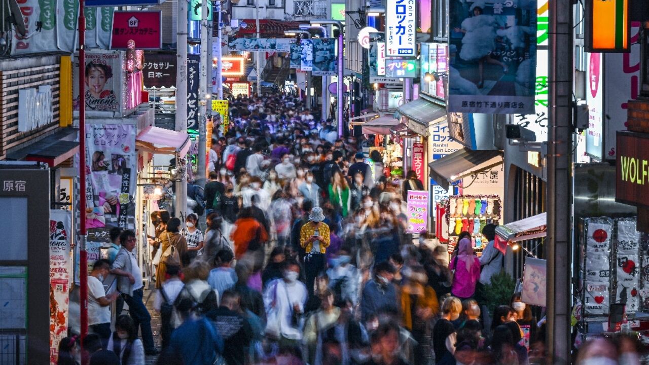 People walking down Takeshita Street in the Harajuku area of Tokyo, a popular shopping district