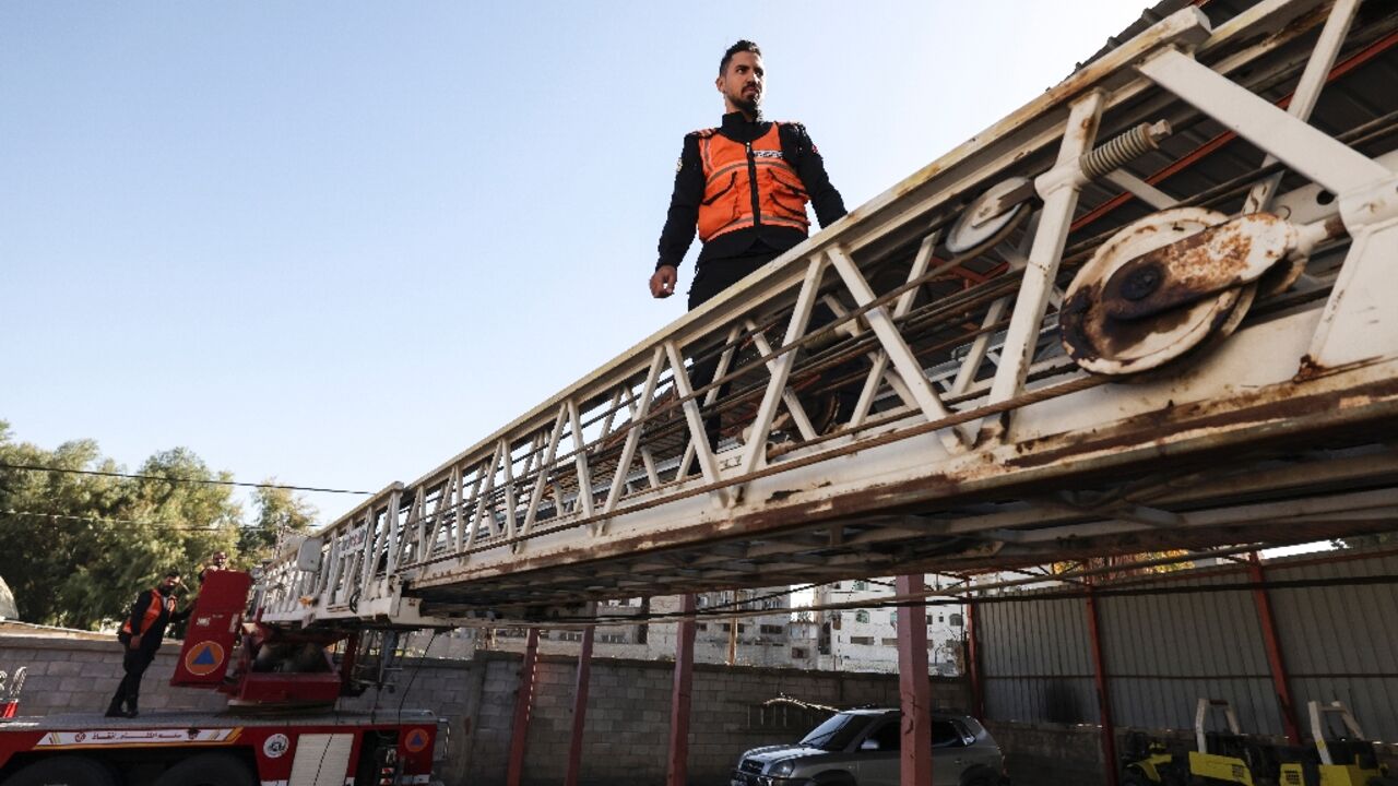 Palestinian firefighters check equipment at Gaza City's civil defence headquarters -- 'Everything is old and worn out,' the unit's chief said Palestinian firefighters check equipment at Gaza City's civil defence headquarters -- 'Everything is old and worn out,' the unit's chief said