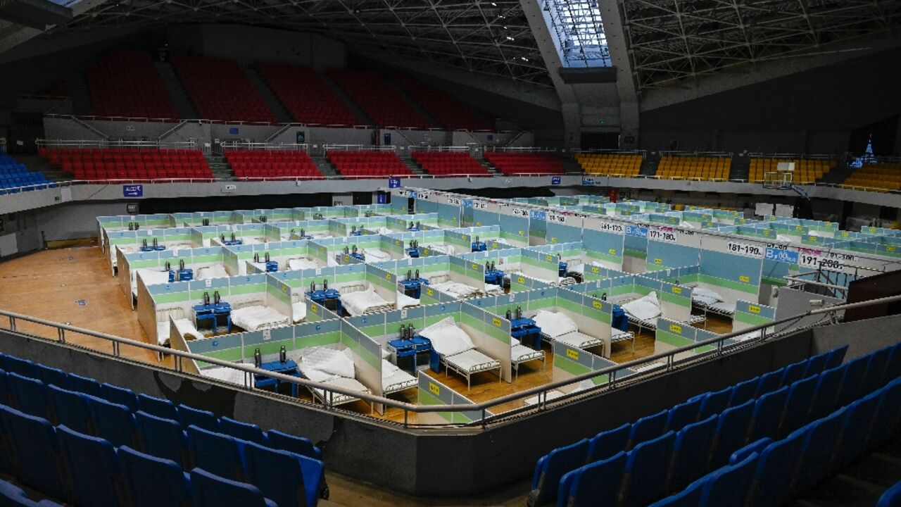 Patient beds in Beijing stadium. China could see over 1 mn Covid deaths in 2023 Patient beds in Beijing stadium. China could see over 1 mn Covid deaths in 2023