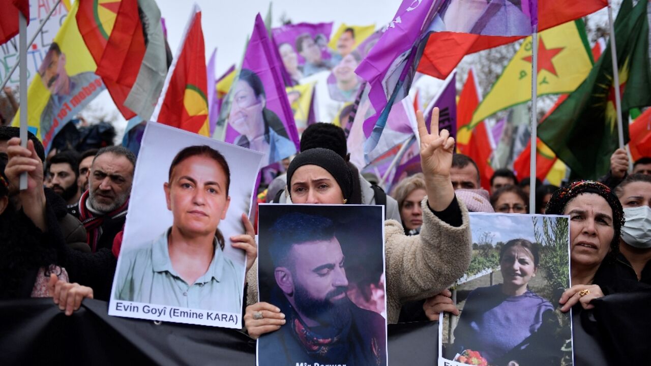 Supporters and members of the Kurdish community rallied in Paris after three people were killed in an attack on Friday