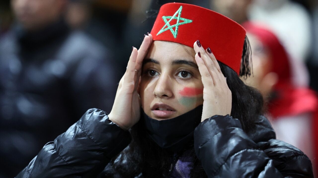 A Morocco supporter in Casablanca watches in despair as France ended her country's hopes of reaching the final