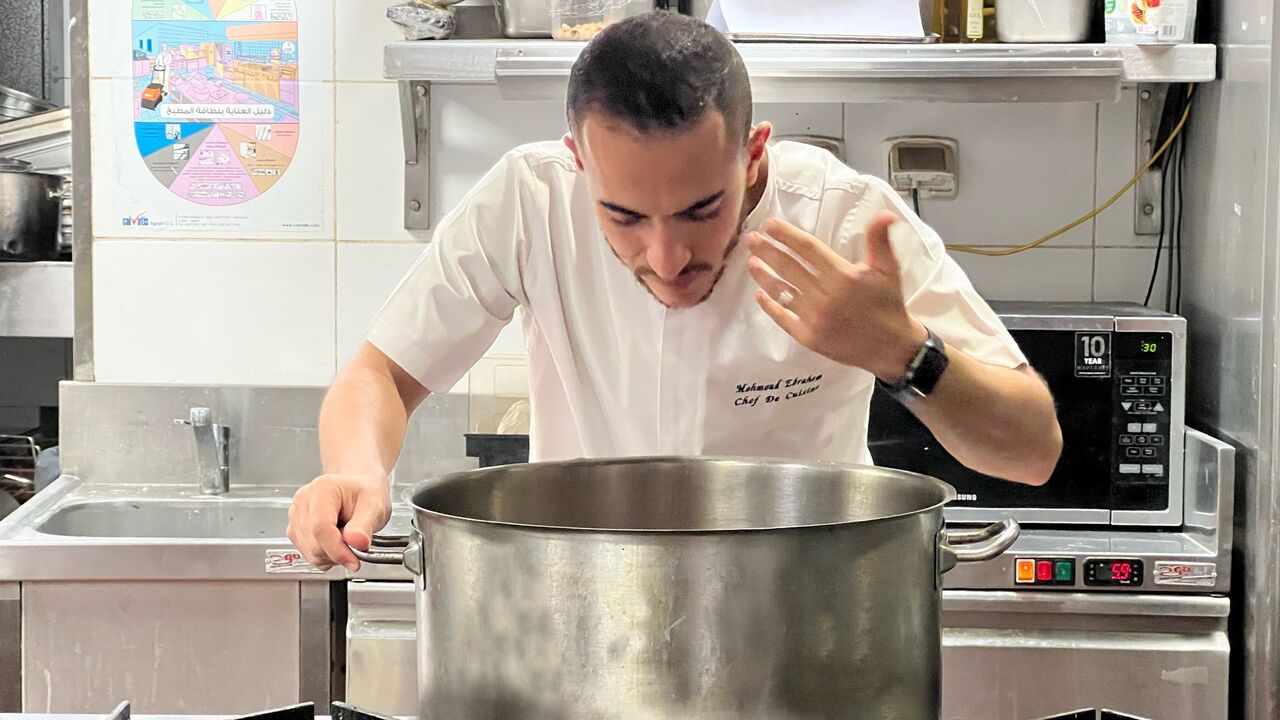 Chef Mahmoud Abd El Gaid prepares a veal steak at Pipa, an Italian restaurant, in Cairo on Monday Nov. 14, 2022.