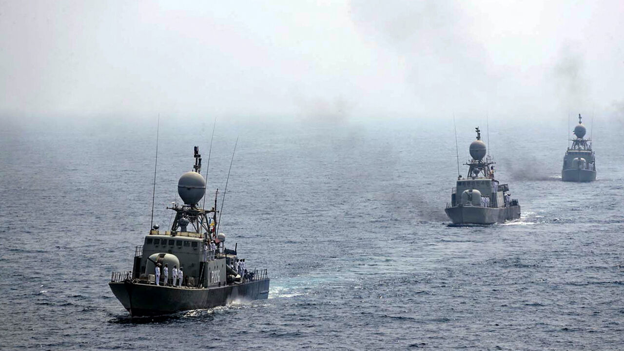 A handout picture provided by the Iranian Army official website on Sept. 12, 2020, shows Iranian naval ships parading during the last day of a military exercise in the Gulf, near the strategic strait of Hormuz in southern Iran.