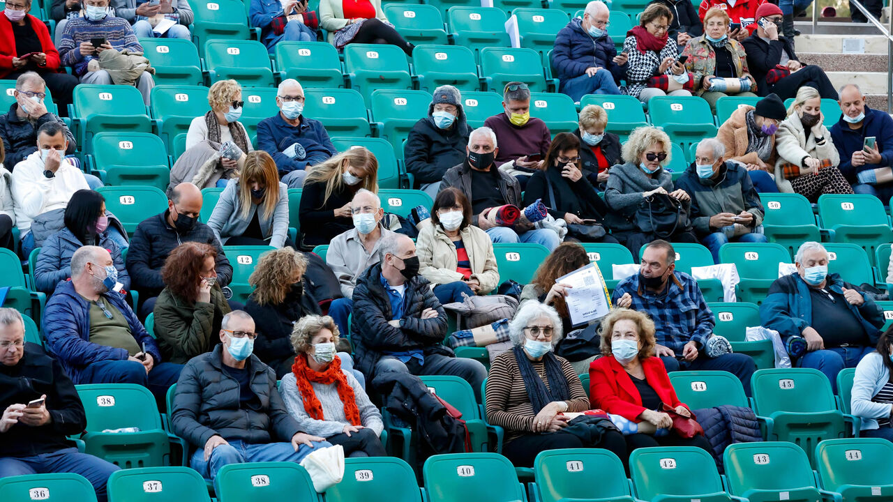 Israelis who were allowed to enter an arena after showing proof of being fully vaccinated against the coronavirus attend a "Green Pass" concert for vaccinated seniors, organized by the municipality of Tel Aviv, Israel, Feb. 24, 2021.