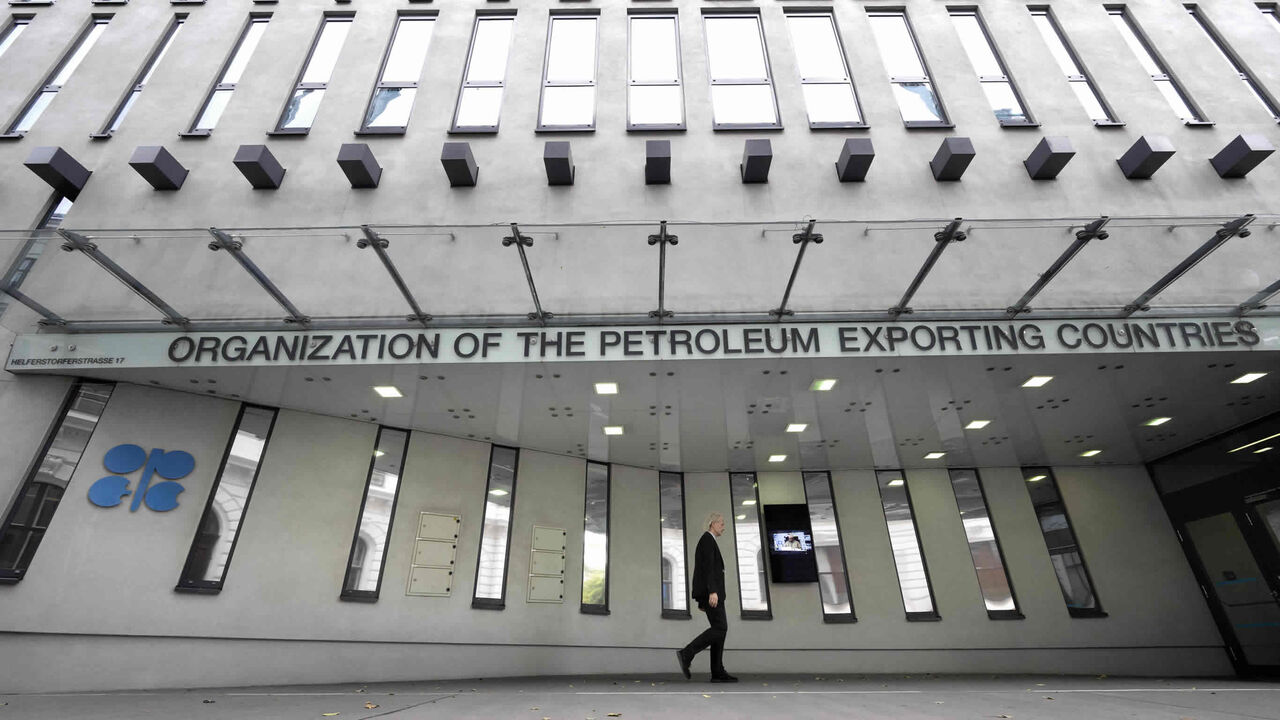 A man walks past OPEC headquarters on the eve of the 45th Meeting of the Joint Ministerial Monitoring Committee and the 33rd OPEC and non-OPEC Ministerial Meeting held Oct. 5, 2022, in Vienna, Austria.