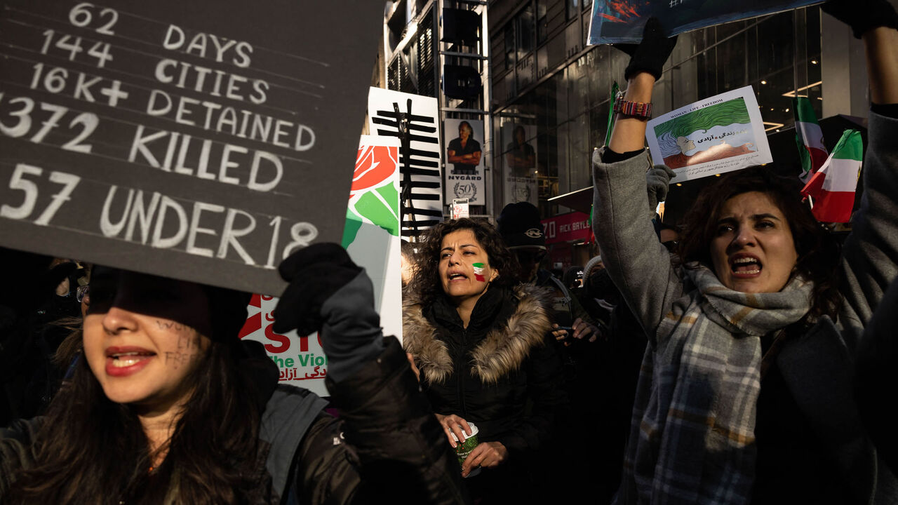 Protesters call on the United Nations to take action against the treatment of women in Iran, following the death of Mahsa Amini while in the custody of the morality police, during a demonstration in Times Square, New York, Nov. 19, 2022.