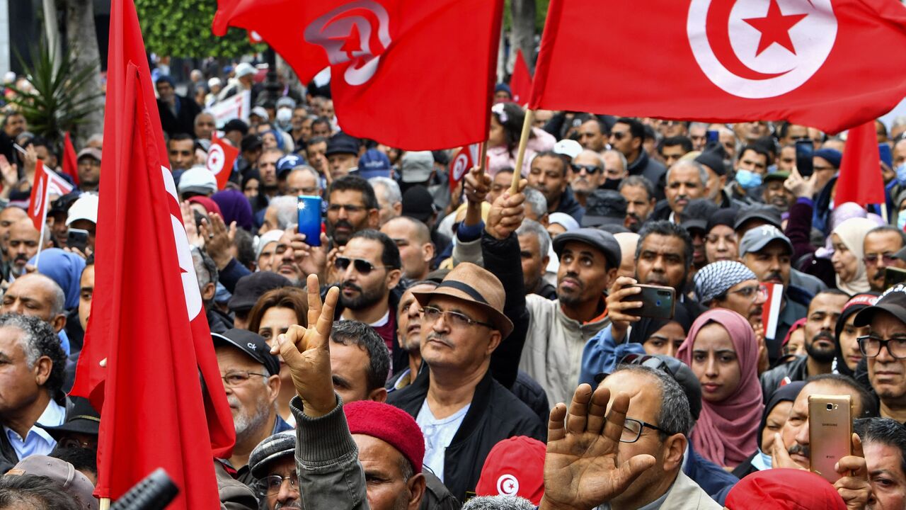 Tunisian demonstrators take part in a rally against President Kais Saied, called for by the opposition "National Salvation Front" coalition, in the capital Tunis, on December 10, 2022. (Photo by FETHI BELAID/AFP via Getty Images)