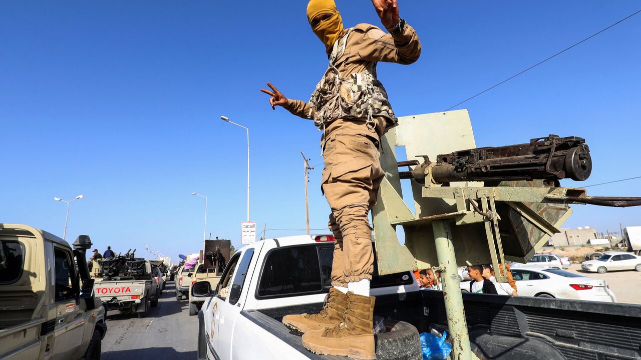 Libyan security forces affiliated with Tripoli-based interim Prime Minister Abdelhamid Dbeibah take part in a parade marking the 6th anniversary of the liberation of Sirte from Islamic State (IS) group, in the northwestern city of Misrata, on December 17, 2022. (Photo by MAHMUD TURKIA/AFP via Getty Images)