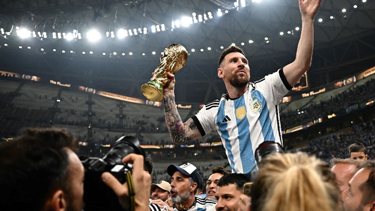 Lionel Messi was carried around the pitch by his Argentina teammates as he held aloft the World Cup trophy 