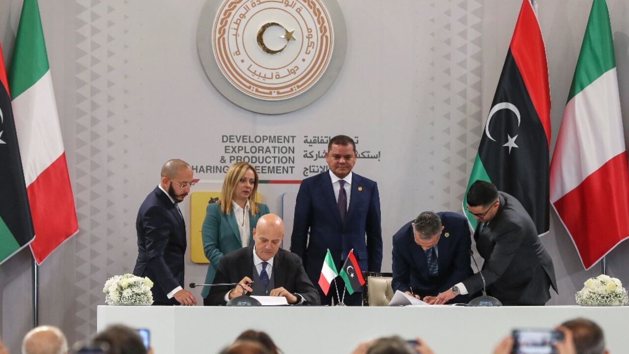 Eni CEO Claudio Descalzi (front L) signs a $8 billion deal with Libyan National Oil Corporation chief Farhat Bengdara (2nd R) to develop two offshore gas fields Eni CEO Claudio Descalzi (front L) signs a $8 billion deal with Libyan National Oil Corporation chief Farhat Bengdara (2nd R) to develop two offshore gas fields