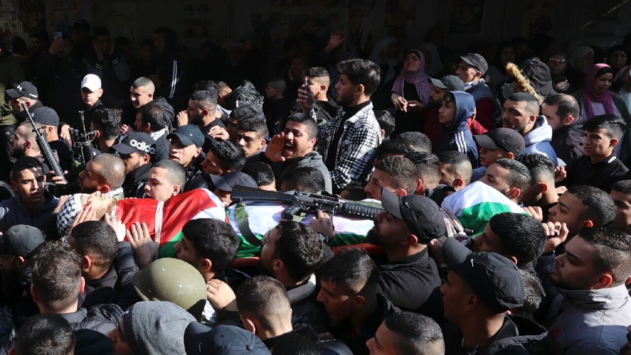 Palestinian mourners and gunmen attend the funeral of Ahmed Abu Junaid, whom the Al-Aqsa Martyrs' Brigade claimed as one of its members Palestinian mourners and gunmen attend the funeral of Ahmed Abu Junaid, whom the Al-Aqsa Martyrs' Brigade claimed as one of its members